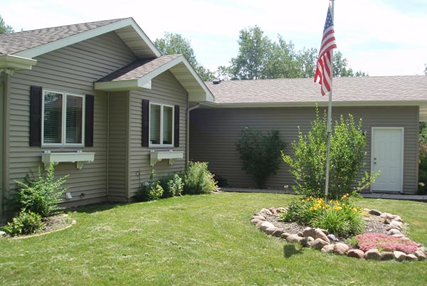 Front view of a residential home available in our housing program